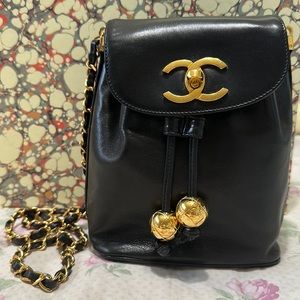 Vintage Chanel bucket bag drawstring with flap. 24k gold plated finish hardware.